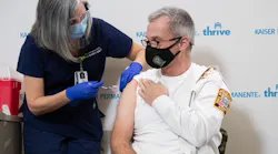 D.C. Fire and EMS Chief John Donnelly is vaccinated for COVID-19 in December.