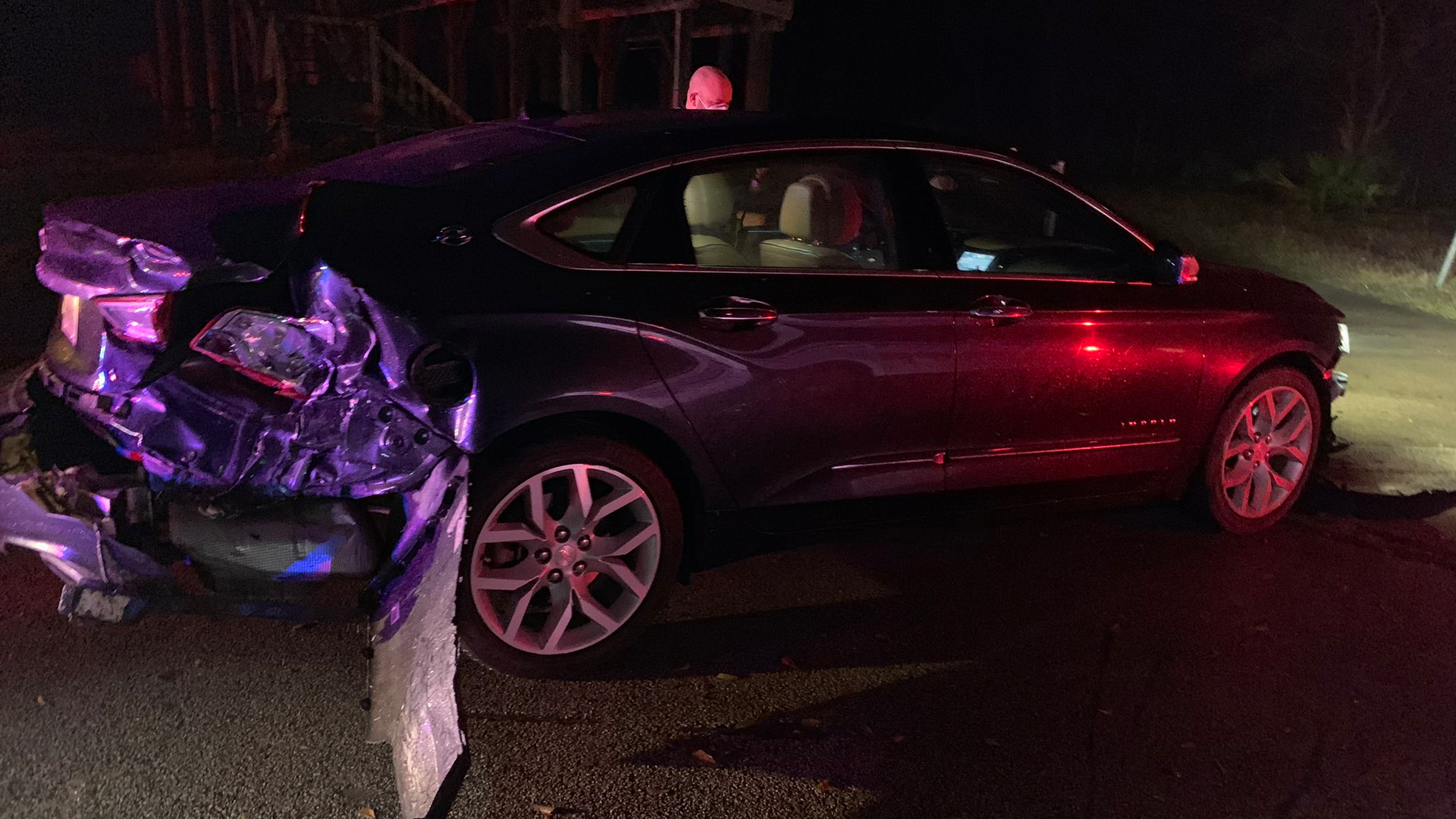 A car crashed twice into a fire apparatus after trying to strike a Harris County, TX, sheriff's deputy at the scene of an accident before trying to flee Sunday.