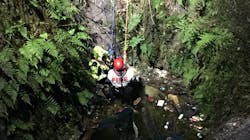 A High Springs, FL, firefighter rappels down a 40-foot deep sinkhole to rescue a woman who had been trapped in the water-filled chasm for nearly 11 hours Thursday. A High Springs, FL, firefighter rappels down a 40-foot deep sinkhole to rescue a woman who had been trapped in the water-filled chasm for nearly 11 hours Thursday.