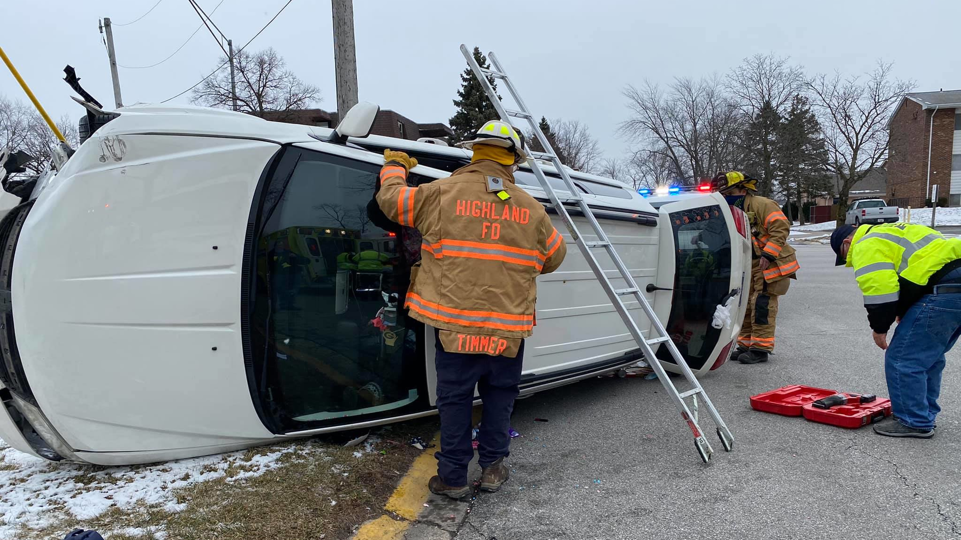 Highland, IN, firefighters freed a woman who was trapped inside her vehicle after a hit-and-run crash with another vehicle Tuesday.