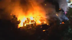 Los Angeles City firefighters battled a large multi-story building fire in the city's Hollywood Hills West neighborhood early Friday.