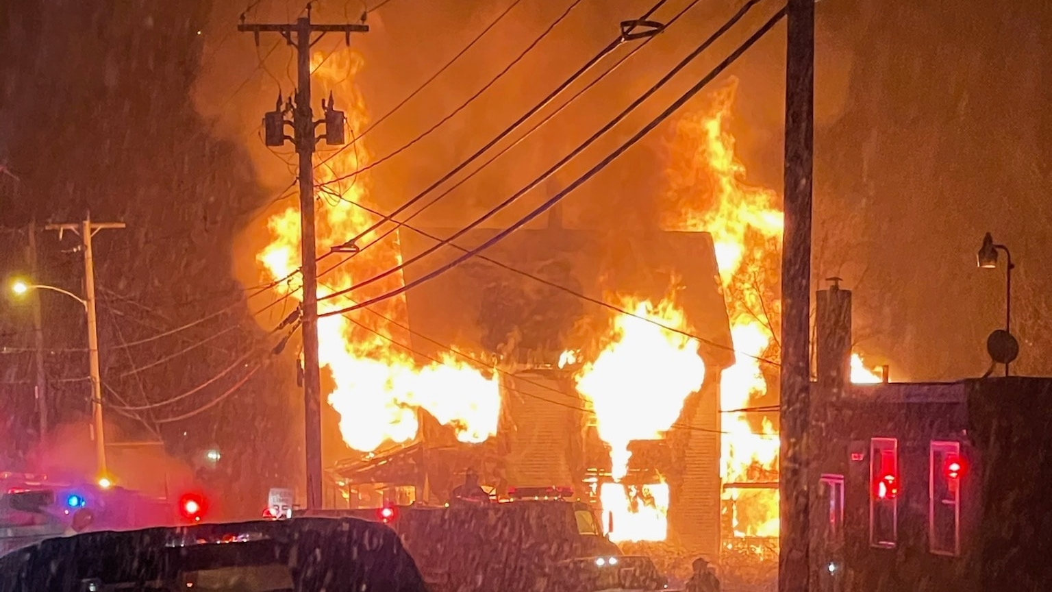 Firefighters from multiple departments battled a fire that destroyed a duplex in Livermore Falls, ME, on Tuesday.