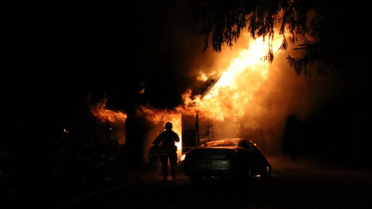 More than 50 firefighters battled a large fire that broke out at a one-story house in the Chapel Hill section of Middletown Township, NJ, late Sunday.