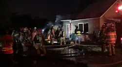 This screen capture from a Twitter video shows firefighters on the scene during a fire at a home in Harrison, PA, on Dec. 31, 2020.
