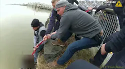 Body camera footage captured a Tarrytown, NY, firefighter and two police officers rescuing a woman who jumped into the Hudson River at RiverWalk Park on Wednesday.