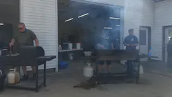 Firefighters man the grills during a drive-through pork chop fry to raise volunteer fire department funds in Chapin, IL, on Sept. 26. 2020.
