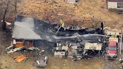 The scene of a house fire in which the roof collapsed, killing two firefighters and two residents in Waynoka, OK, on Friday Jan. 29, 2021.
