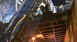 At least eight people were injured when a New York City tandem bus crashed through traffic barriers in the Bronx and fell 50 feet to the road below Thursday, leaving the vehicle dangling off an overpass.