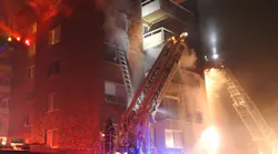 Roughly 80 firefighters battled a four-alarm blaze that broke out at an apartment complex outside of Harvard Square in Cambrdige, MA, on Tuesday.