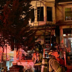 A D.C. Fire and EMS firefighter was injured in a rowhouse fire in the Petworth neighborhood that killed two people early Thursday.