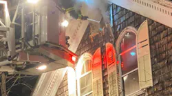 Middleboro, MA, firefighters rescued two people from a burning home Wednesday despite hoarding conditions hampering efforts.