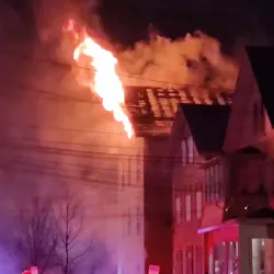 New Haven, CT, firefighters rescued a man from a fatal two-alarm fire at a multi-family home early Monday.