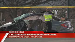 A mangled vehicle sits in the road after it was struck by a Denver Fire Department apparatus at an intersection on Saturday, Jan. 23, 2021.