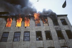 Heavy fire conditions on the fifth floor initially trapped some occupants. After the use of mobile handheld hoselines assisted their escape, a defensive attack was initiated. Heavy fire conditions on the fifth floor initially trapped some occupants. After the use of mobile handheld hoselines assisted their escape, a defensive attack was initiated.