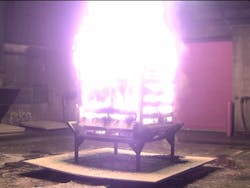 Figure 2: Comparison of soot production during peak burning period for six pallets and one bale of straw (left) and upholstered sofa (right). Both fuel packages had comparable peak HRRs. Figure 2: Comparison of soot production during peak burning period for six pallets and one bale of straw (left) and upholstered sofa (right). Both fuel packages had comparable peak HRRs.