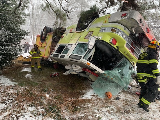 The pumper rolled over while responding to an EMS call on a snow-covered road.