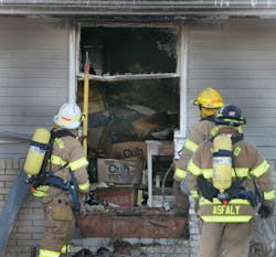 Firefighters from the Lake Johanna, MN, Fire Department had to expand the window on a single-family house to remove debris to search the residence. Firefighters from the Lake Johanna, MN, Fire Department had to expand the window on a single-family house to remove debris to search the residence.