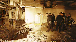 In this file photo from Feb. 27, 1993, police and firefighters inspect the bomb created inside an underground parking garage of New York's World Trade Center the day after an explosion tore through it.