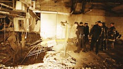 In this file photo from Feb. 27, 1993, police and firefighters inspect the bomb created inside an underground parking garage of New York&apos;s World Trade Center the day after an explosion tore through it.