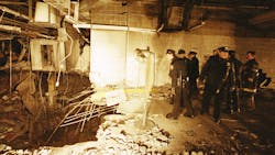 In this file photo from Feb. 27, 1993, police and firefighters inspect the bomb created inside an underground parking garage of New York's World Trade Center the day after an explosion tore through it. In this file photo from Feb. 27, 1993, police and firefighters inspect the bomb created inside an underground parking garage of New York's World Trade Center the day after an explosion tore through it.