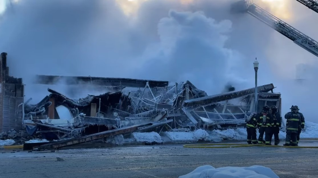 Hammond, IN, firefighters worked for more than 14 hours in frigid cold to put out a fire that collapsed a building Sunday.
