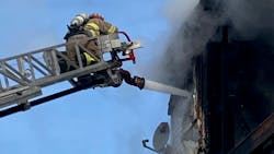 A Sutton, MA, firefighter suffered breathing problems and chest discomfort while battling a fire at a three-decker in Milbury on Sunday. A Sutton, MA, firefighter suffered breathing problems and chest discomfort while battling a fire at a three-decker in Milbury on Sunday.