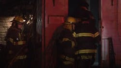 Minneapolis firefighters rescued a man from a burning house early Thursday. Minneapolis firefighters rescued a man from a burning house early Thursday.