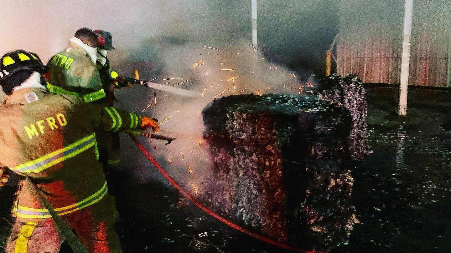 Mobile, AL, firefighters worked for hours to extinguish burning paper bales during a three-alarm fire early Tuesday.