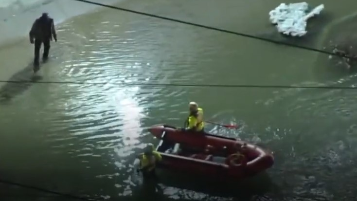 Philadelphia firefighters rescued at least 11 people who were trapped after a water main broke in the city's Nicetown area Tuesday.