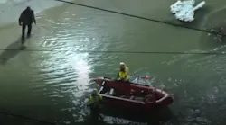 Philadelphia firefighters rescued at least 11 people who were trapped after a water main broke in the city's Nicetown area Tuesday.