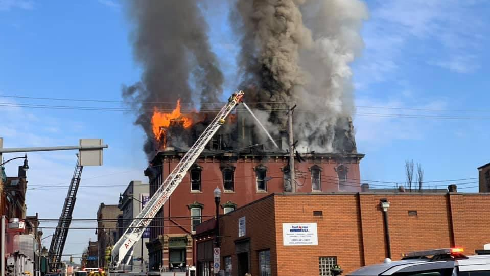 A four-alarm fire collapsed nearly half of the South Side Chamber of Commerce building in Pittsburgh on Monday.