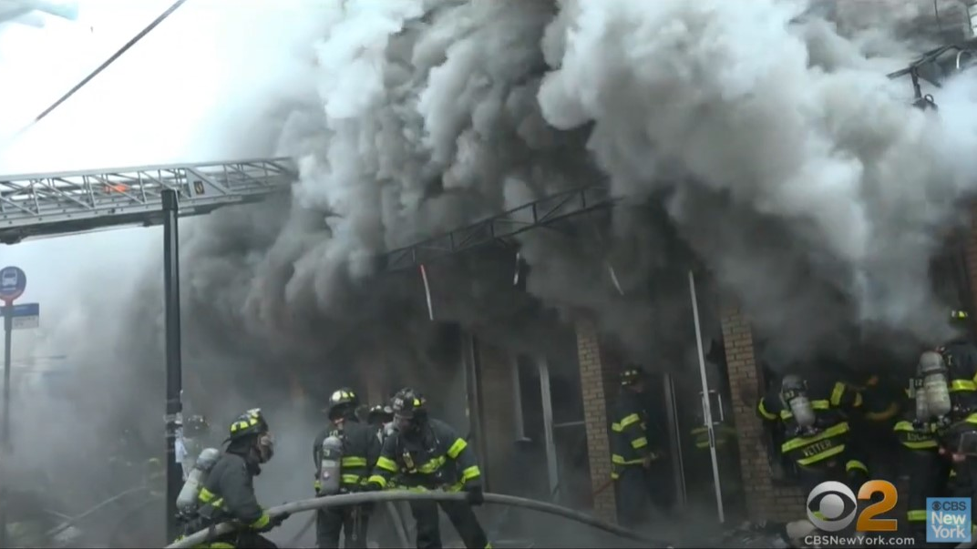 Two FDNY firefighters were injured battling a massive five-alarm blaze that tore through Queens dollar store early Sunday.