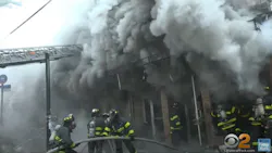 Two FDNY firefighters were injured battling a massive five-alarm blaze that tore through Queens dollar store early Sunday.