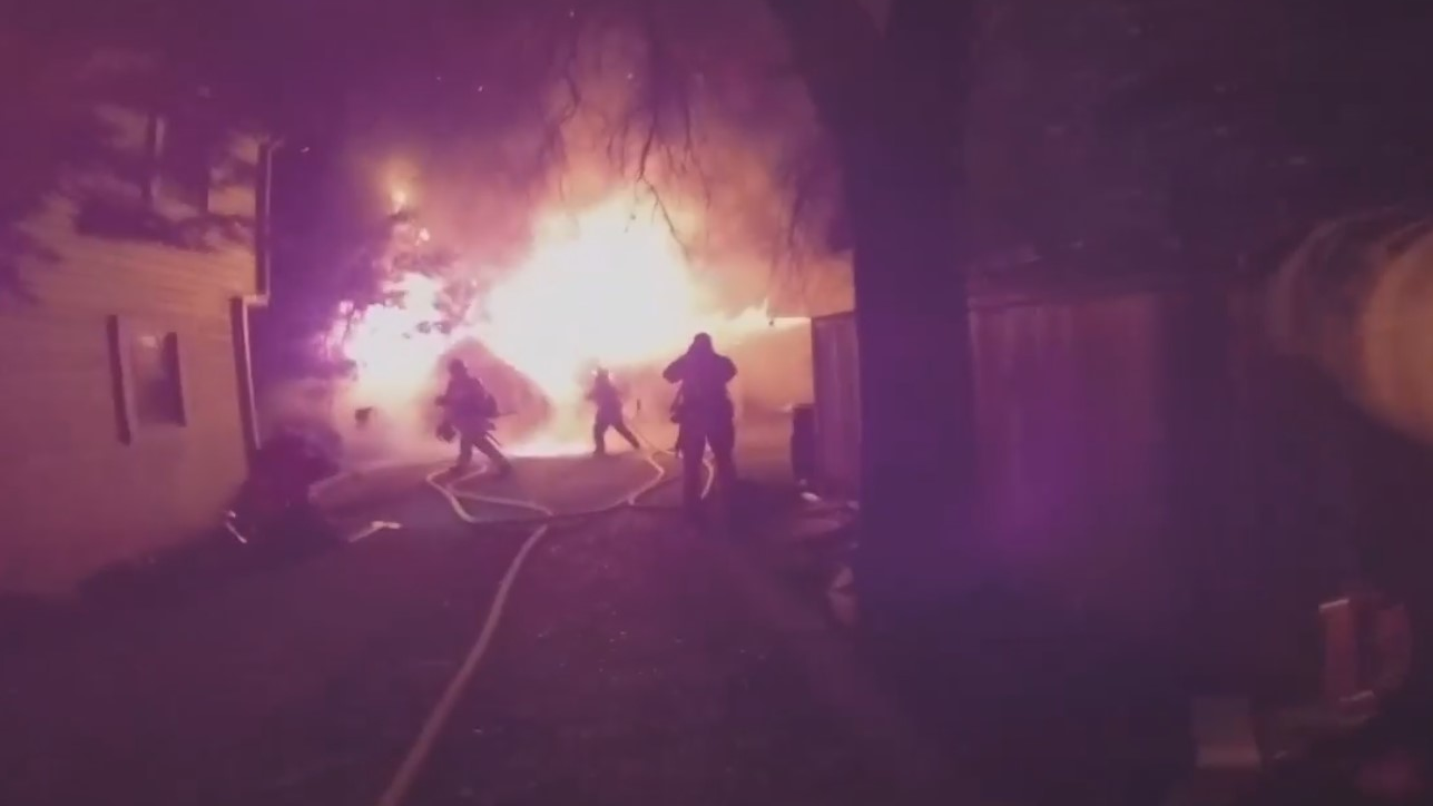 A Sacramento, CA, Metropolitan Fire District firefighter's body camera captured crews tackling a fire at a 100-year-old barn that had been turned into multi-unit housing Tuesday.