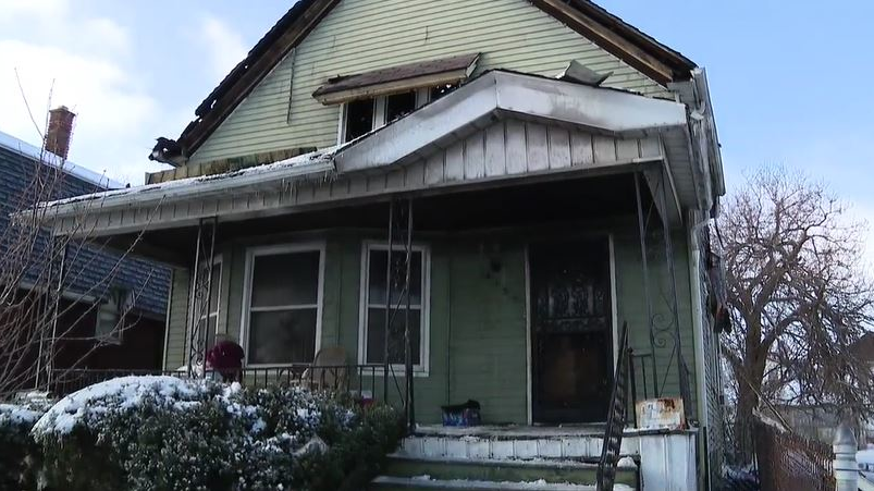 Firefighters rescued four men from this burning group home early Friday morning.