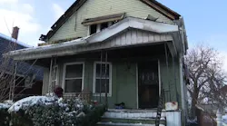 Firefighters rescued four men from this burning group home early Friday morning.