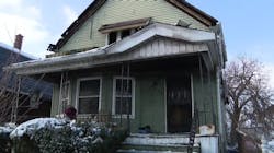 Firefighters rescued four men from this burning group home early Friday morning. Firefighters rescued four men from this burning group home early Friday morning.