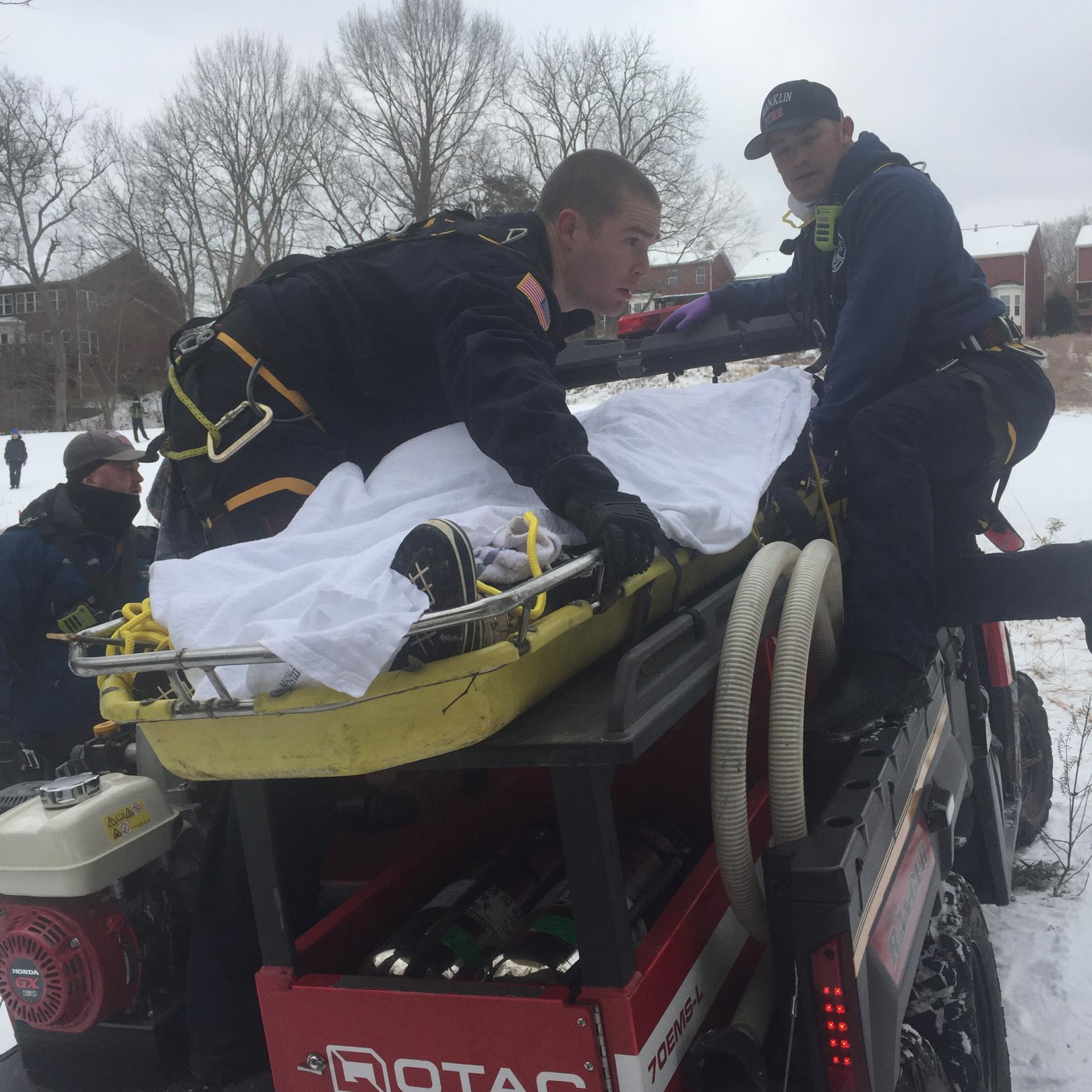 Franklin, TN, firefighters rescued a mother after she injured herself saving her 3-year-old child, who had gone into the Harpeth River while sledding Tuesday.