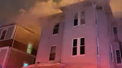 Worcester firefighters called five alarms to contain a fire in a three-story, mutli-family home Friday night.