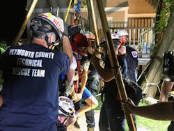 Even with the victim strapped into a packaging and extrication system, the rescuers found it difficult to get the victim’s shoulders through the top of the confined space. Ultimately, they had to get one shoulder through first and then manipulate the second shoulder to complete extrication. Even with the victim strapped into a packaging and extrication system, the rescuers found it difficult to get the victim’s shoulders through the top of the confined space. Ultimately, they had to get one shoulder through first and then manipulate the second shoulder to complete extrication.
