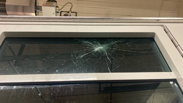 The window of a Boulder, CO, Fire Department apparatus was damaged when parties in the city's University Hill neighborhood spun out of control Saturday.