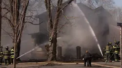 Two firefighters were injured battling a house fire in Voorhees, NJ, on Monday.