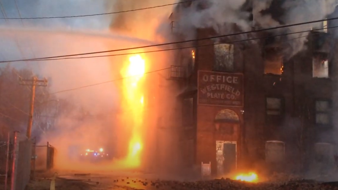 Firefighters from the five departments in Enfield, CT, battled a three-alarm fire early Wednesday.