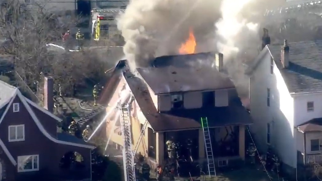 Two firefighters were injured battling a Millvale, PA, house fire Monday.