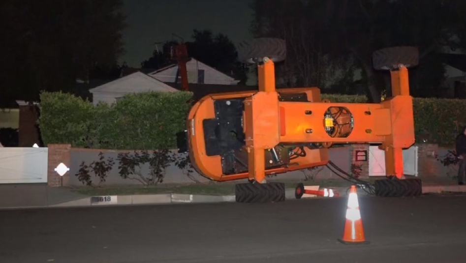 High winds toppled a crane being used during the filming of a Netflix movie in Pasadena on Tuesday, sending it crashing into a two-story house.