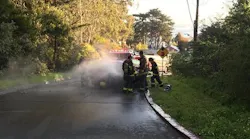 San Francisco firefighters saved an unconscious man trapped in a burning car following a solo-vehicle collision Sunday.