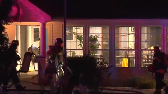 Firefighters rescued two people in their beds from a burning St. Charles County, MO, assisted living facility early Tuesday.