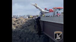 A pickup dangles off the side of a bridge above a canyon in Hagerman, ID, on Monday March 15, 2021. A pickup dangles off the side of a bridge above a canyon in Hagerman, ID, on Monday March 15, 2021.