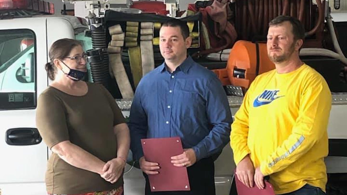 Joan Grimm thanks Airville firefighter Ryan Shaull (center) and Citizens firefighter Paul Scott for rescuing her last month.