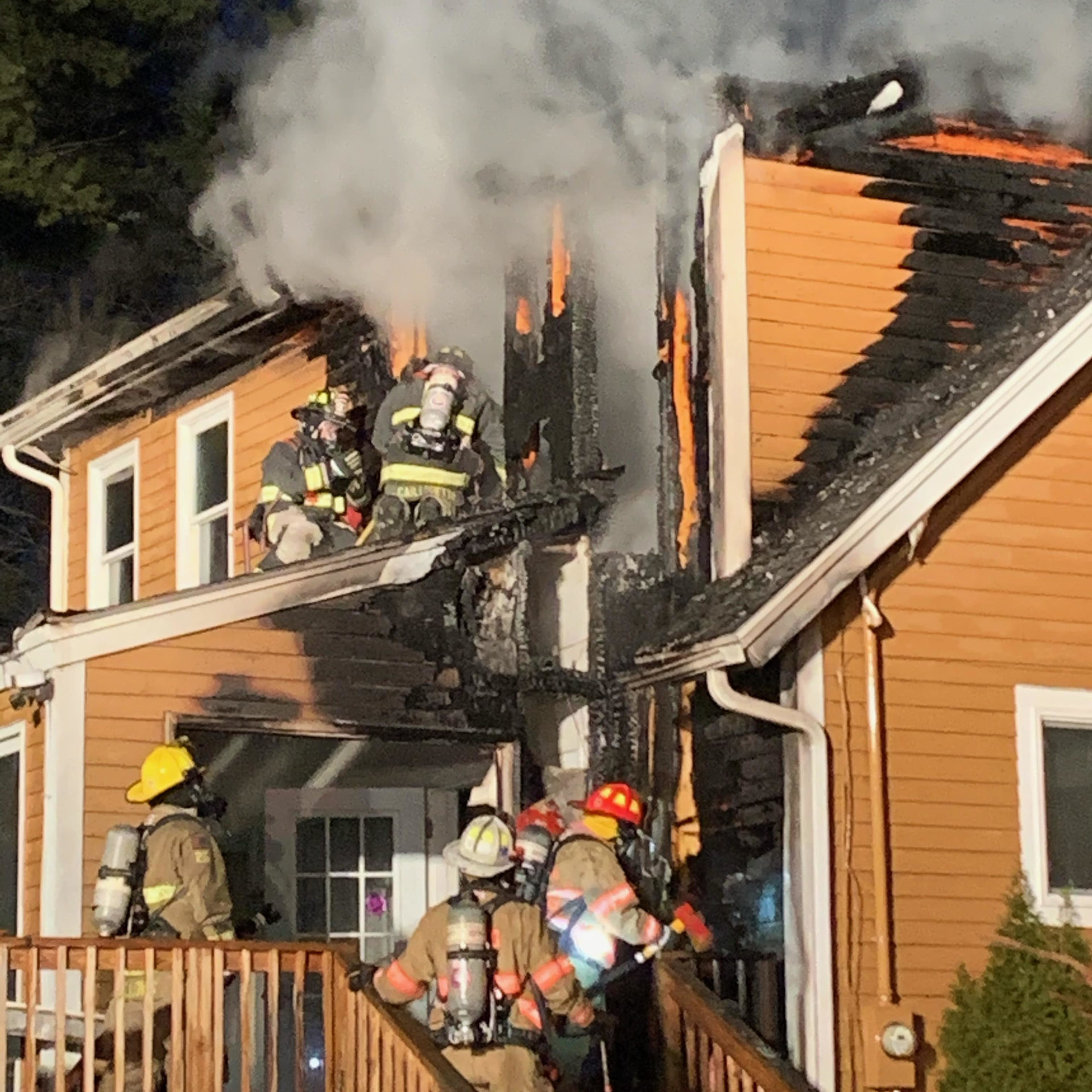 Crews from a dozen departments battled a two-alarm fire that broke out at the home of Kingston, NH, Fire Department's chief Sunday.
